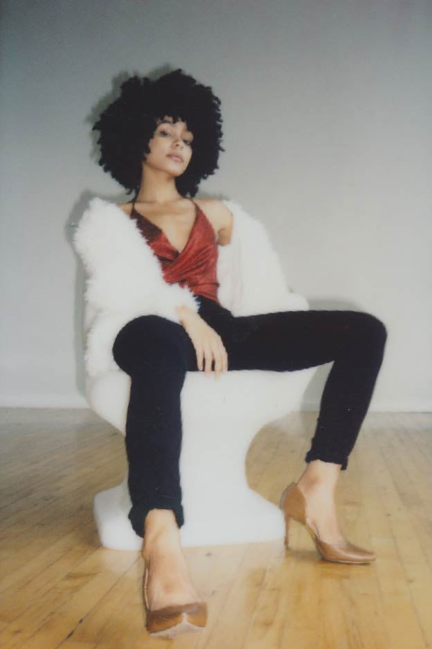 female model wearing faux fur coat