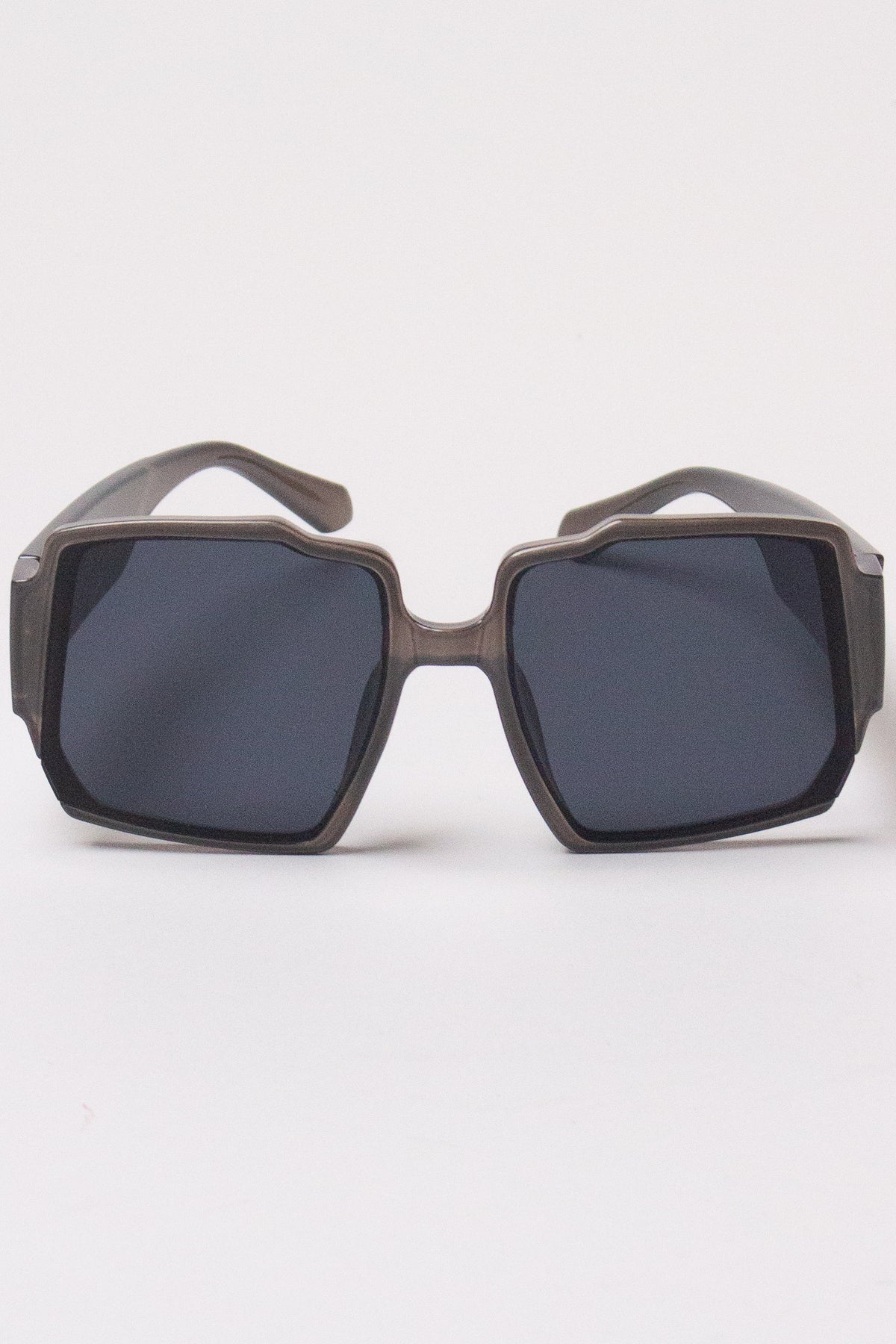 Translucent grey oversized geometric square sunglasses with dark lenses
