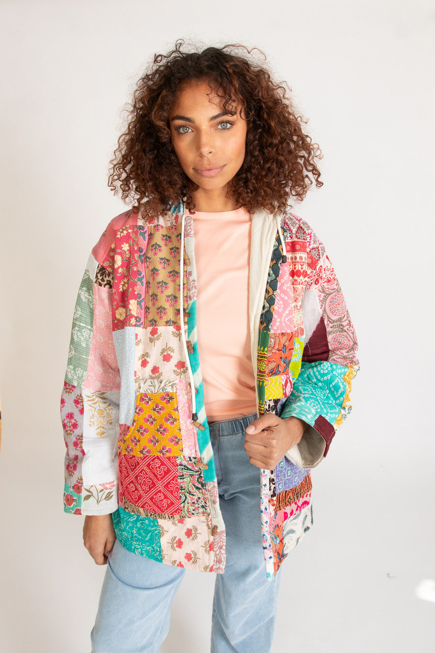 Woman wearing colorful patchwork jacket