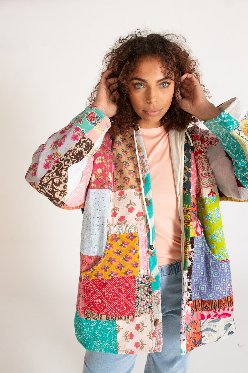 Woman wearing colorful patchwork jacket