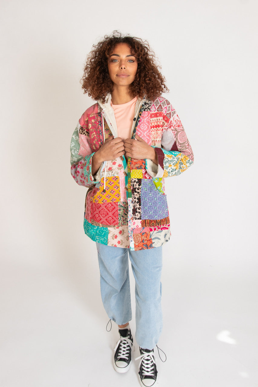 Woman wearing colorful patchwork jacket
