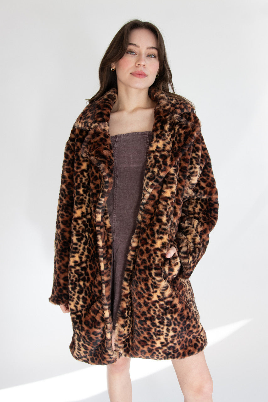 Woman Wearing Faux Fur Leopard Coat