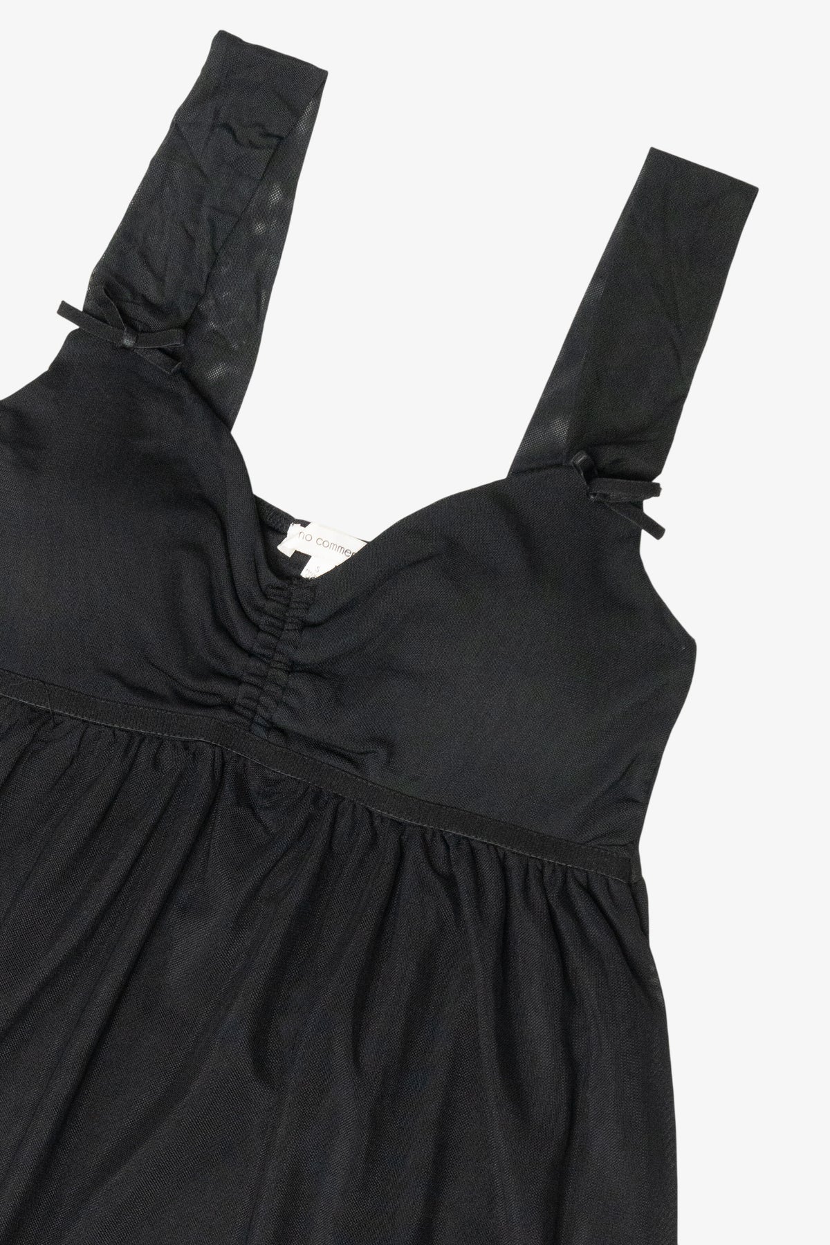Black sleeveless babydoll top with ruched sweetheart bust and wide sheer straps with bows