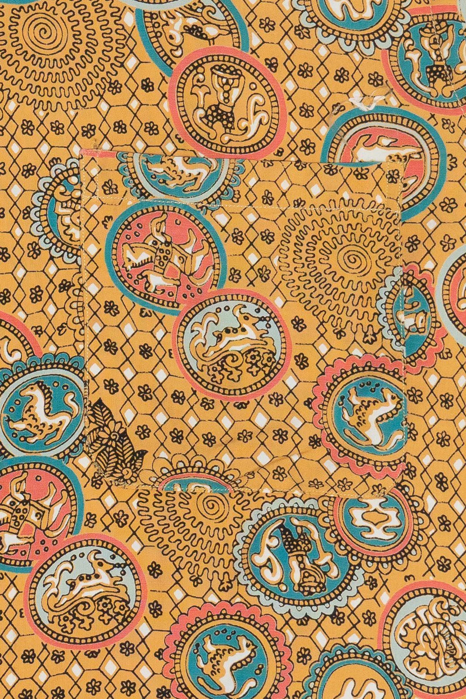 Patterned fabric with circular designs featuring animals on a yellow background