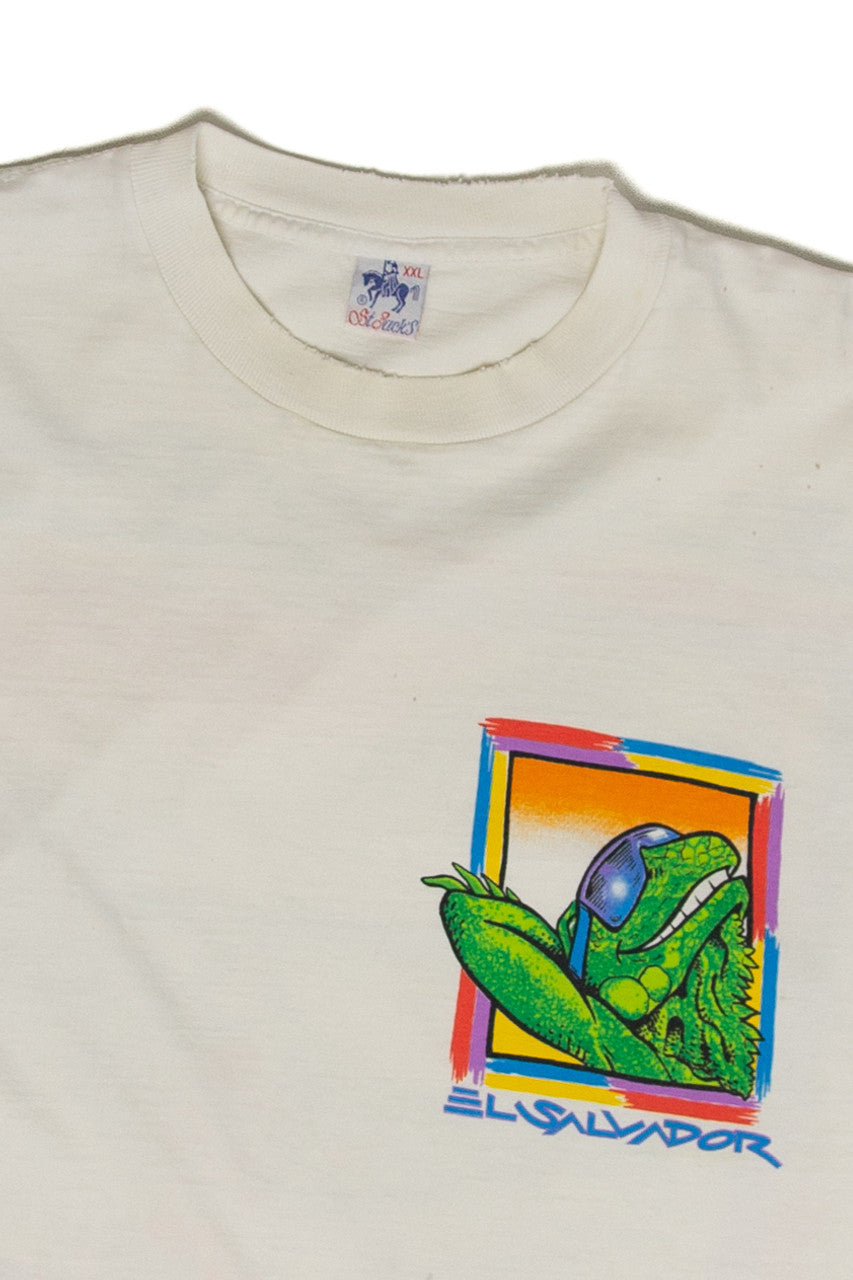 Vintage white t-shirt with colorful El Salvador lizard graphic wearing sunglasses on the chest pocket area