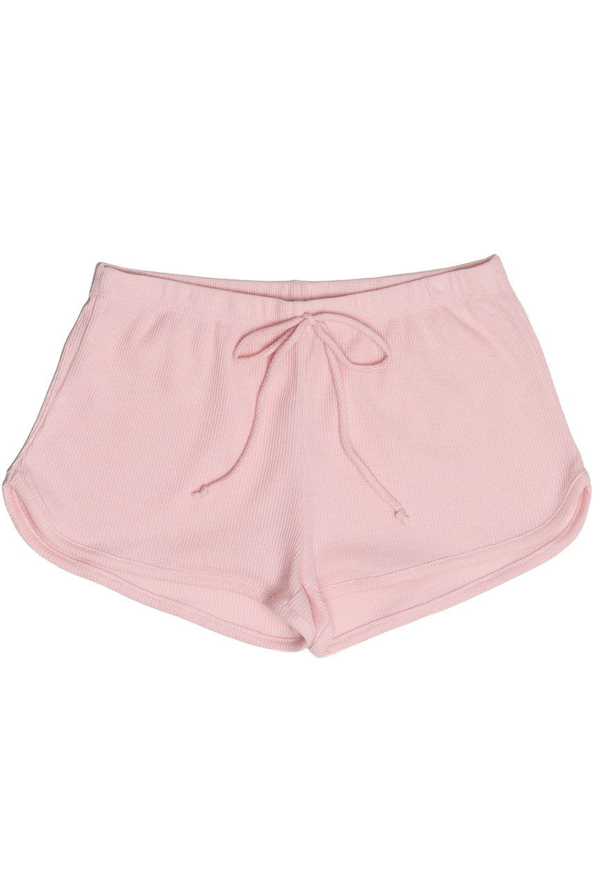 Pink thermal Dolphin shorts with drawstring waist and curved hem, designed for comfort and casual wear