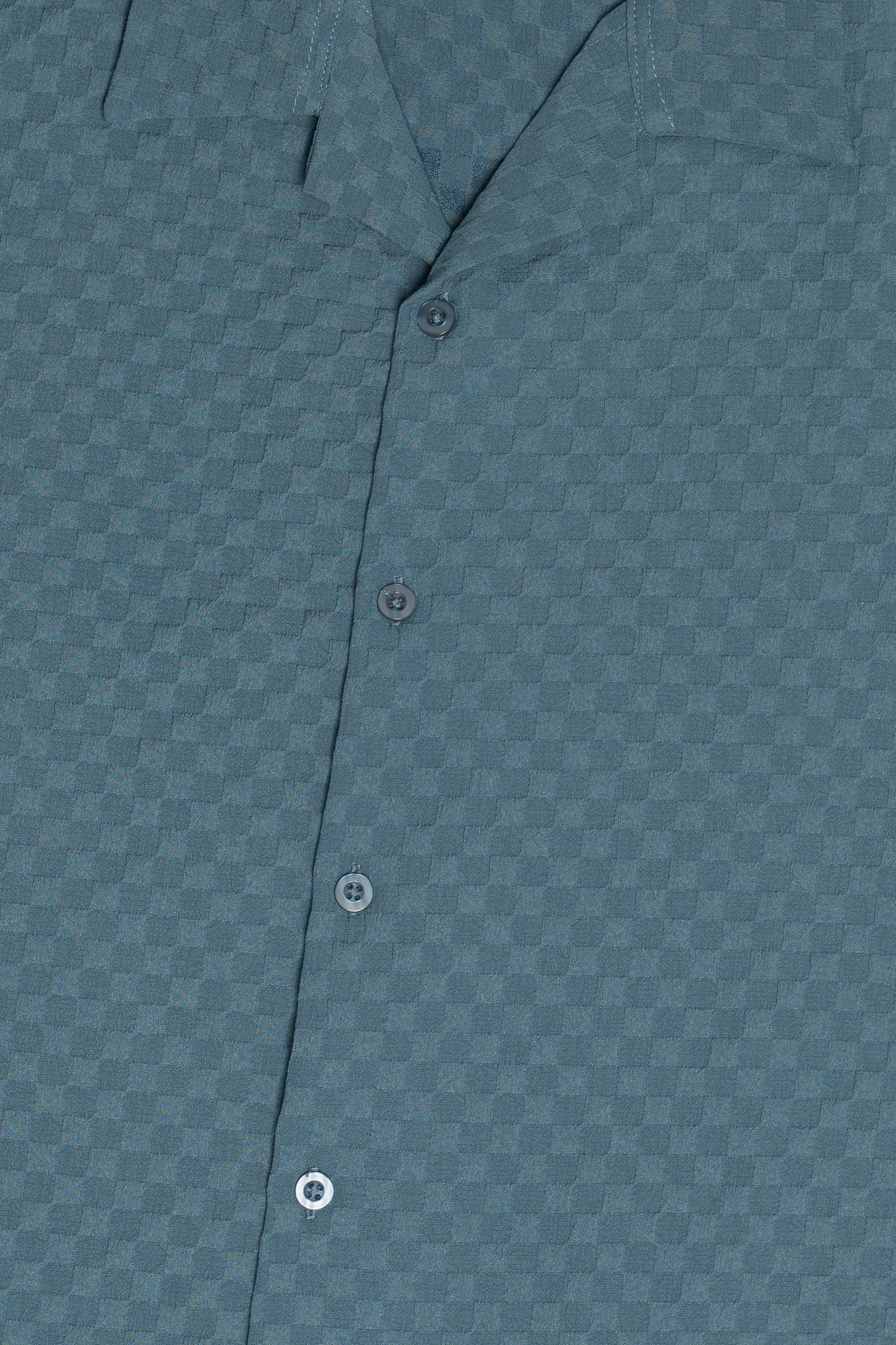 Detail Of Blue Embossed Grid Button Down