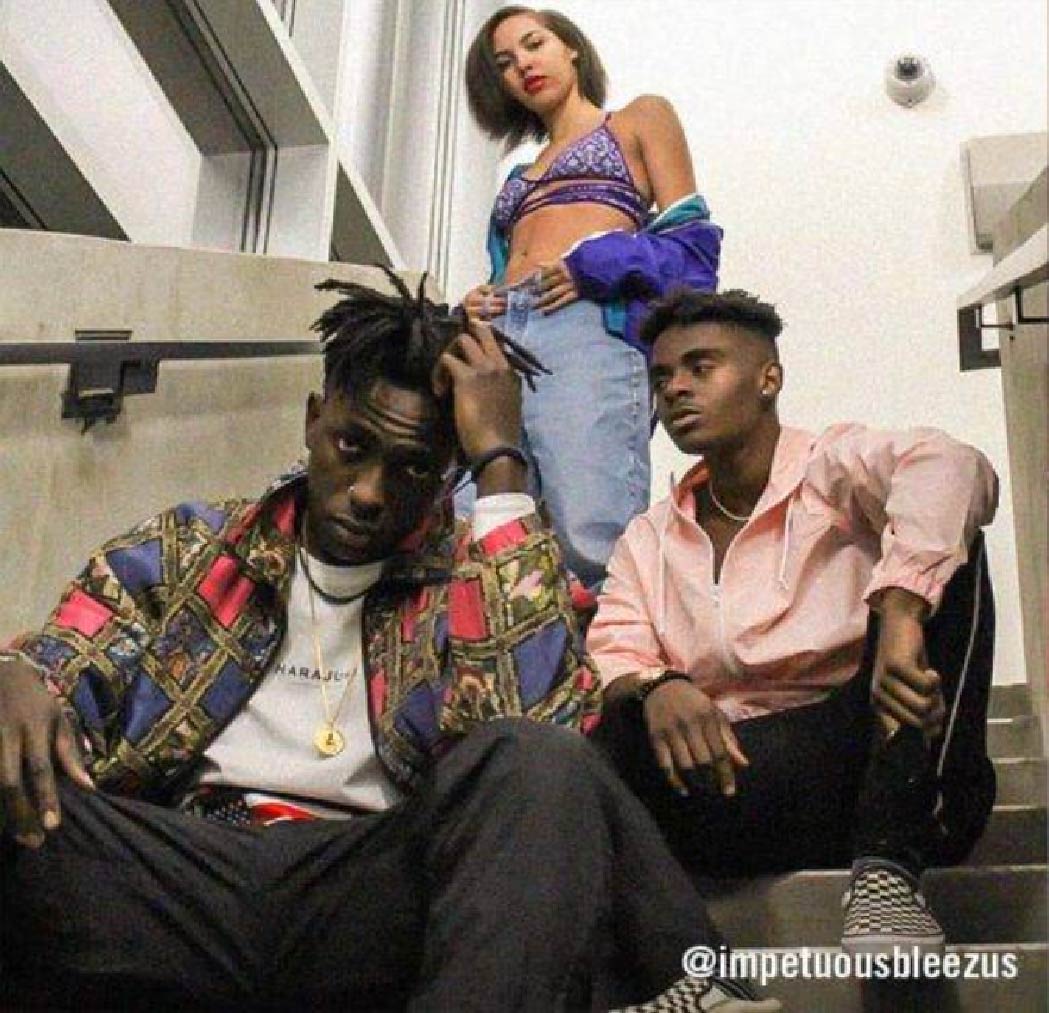 @impetuousbleezus sporting 90's-inspired fits consisting of 90's patterned jackets, light-wash denim, and graphic tops.