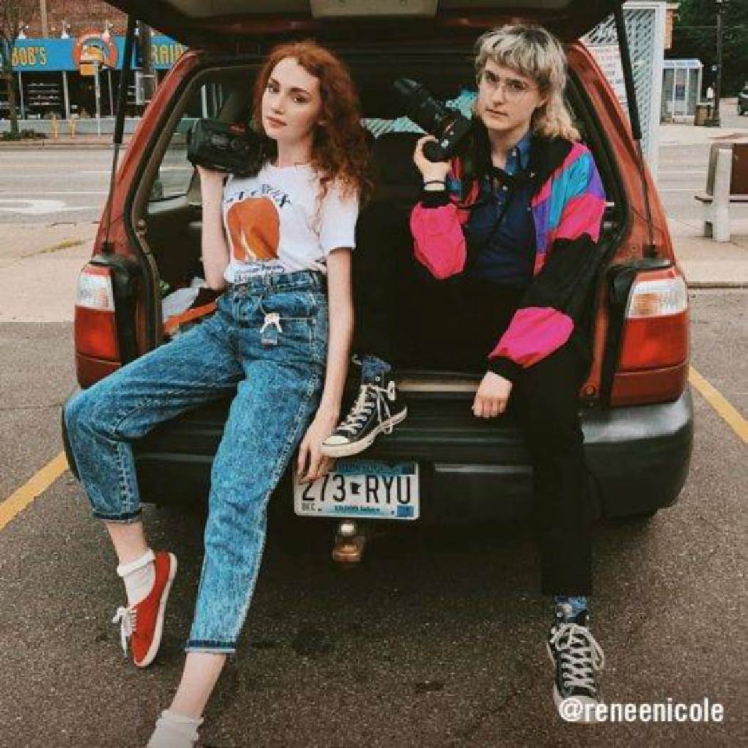 @reneenicole two friends in windbreakers and cuffed jeans hanging at the tailgate–authentic 90's casual.