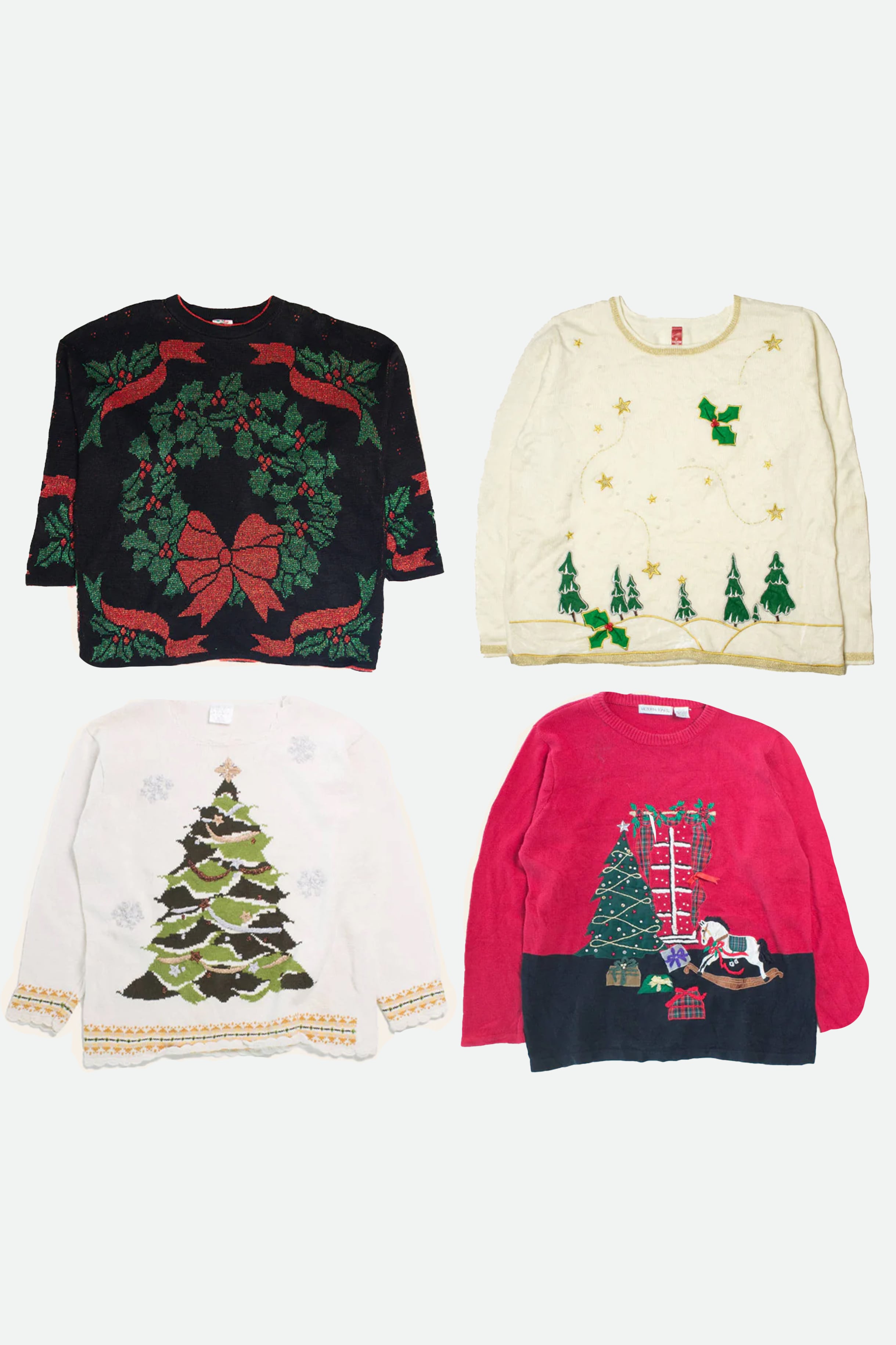 Four vintage women’s Christmas sweaters with holiday designs including wreaths, trees, and presents on white background