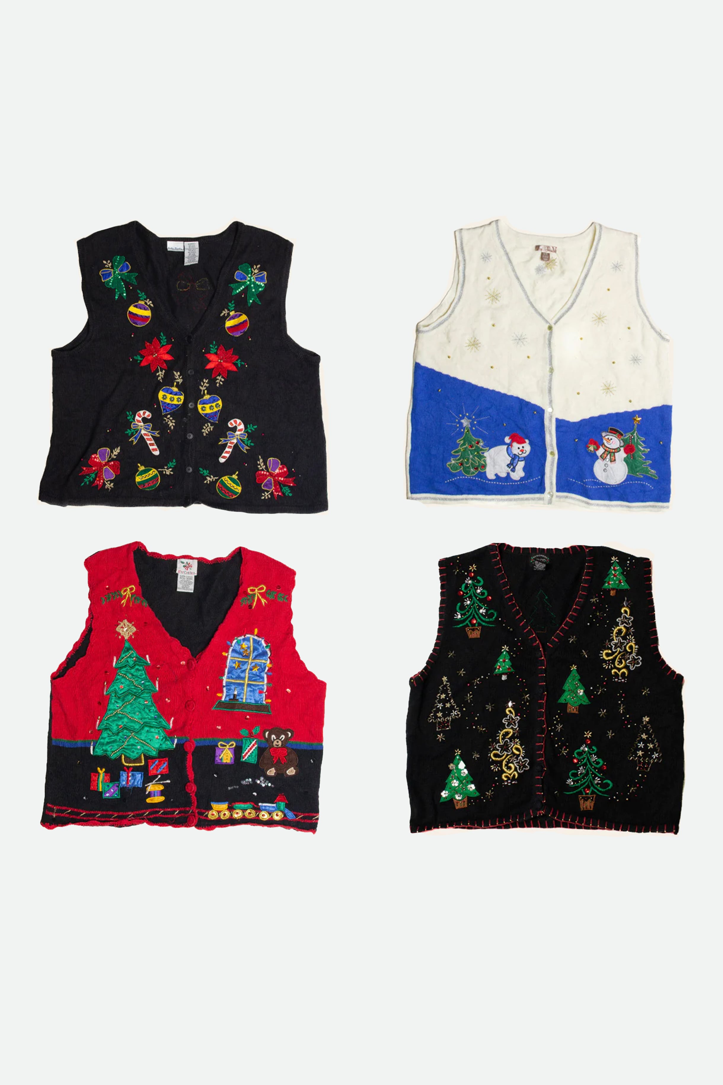 Four assorted vintage ugly Christmas sweater vests with festive holiday designs on a white background.