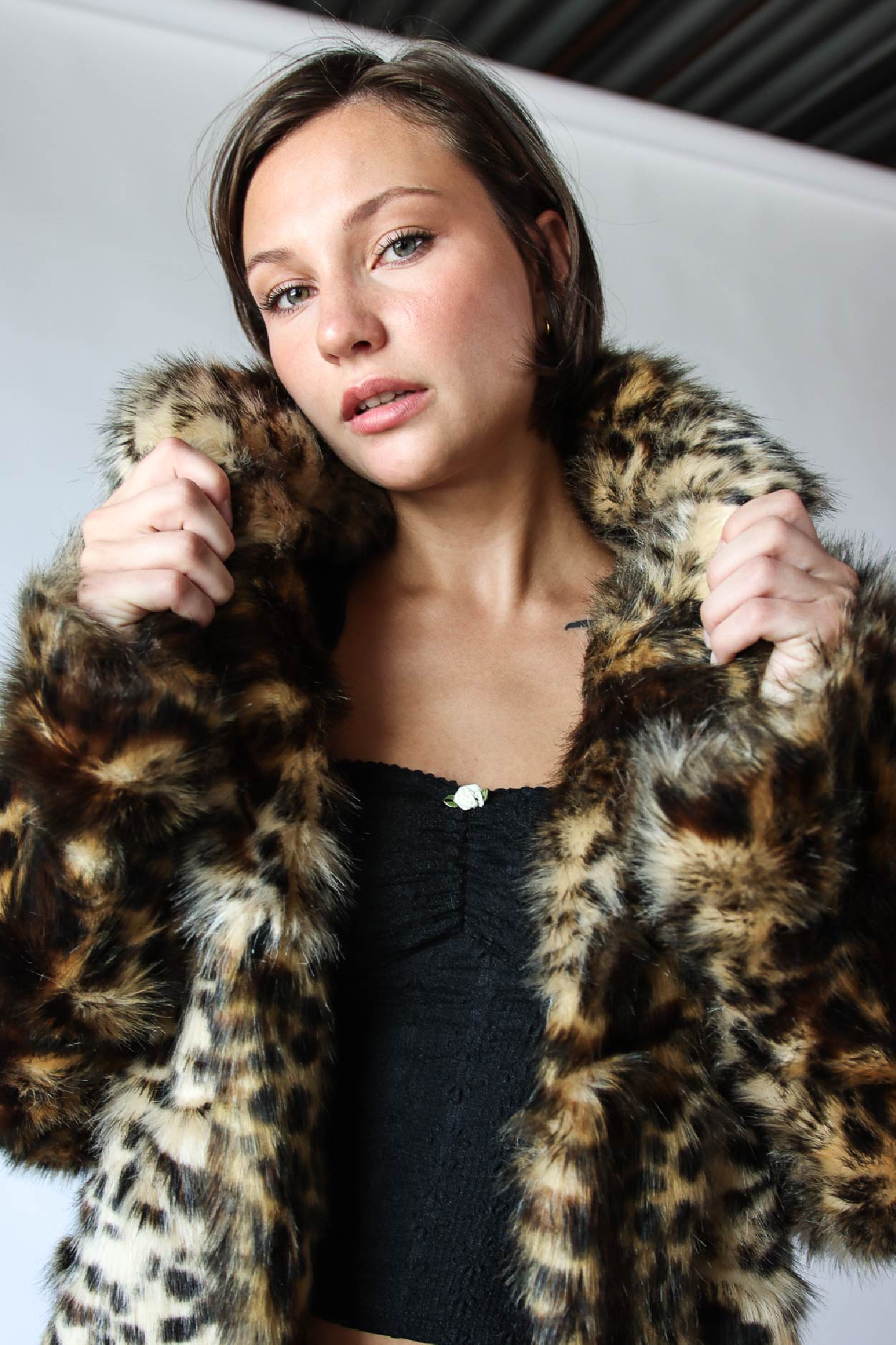 model wearing vintage faux fur cheetah coat