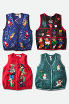 Four vintage ugly Christmas sweater vests with colorful holiday-themed designs laid flat on white background.