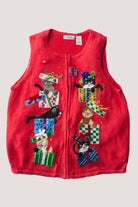 Red vintage ugly Christmas sweater vest with playful cats popping out of colorful gift boxes and decorative embellishments