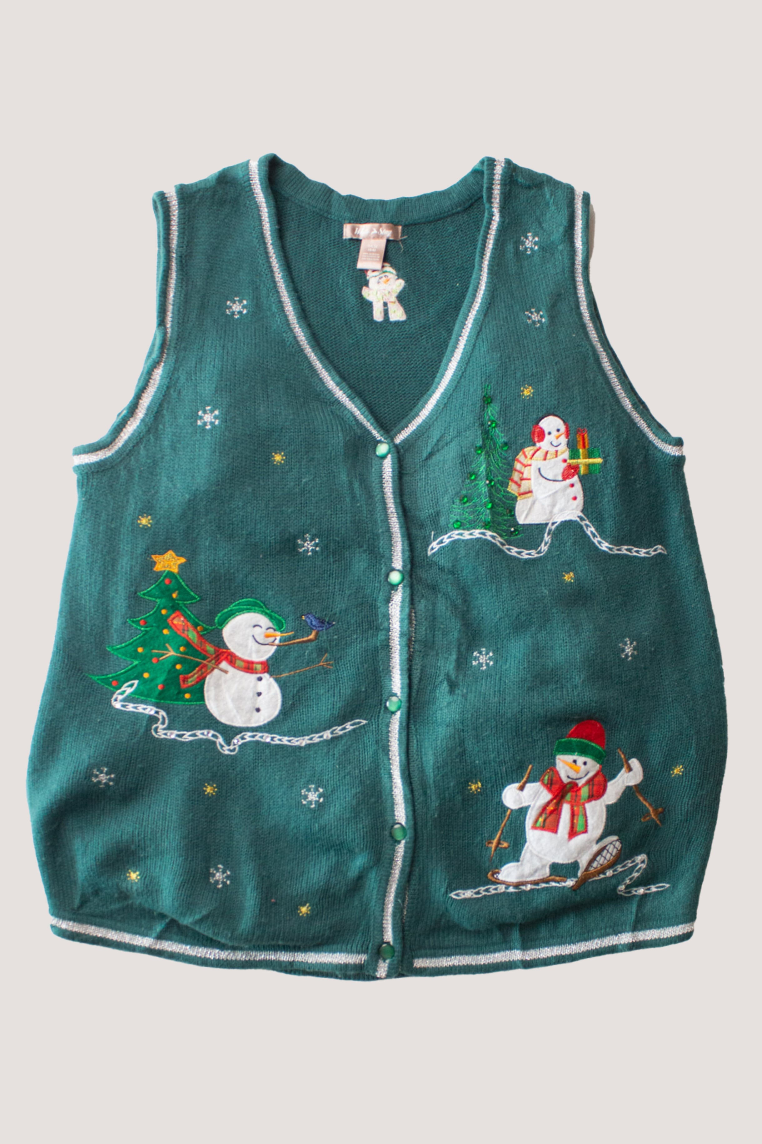Vintage green Christmas sweater vest with embroidered snowmen, tree, and snowflake designs, button front closure