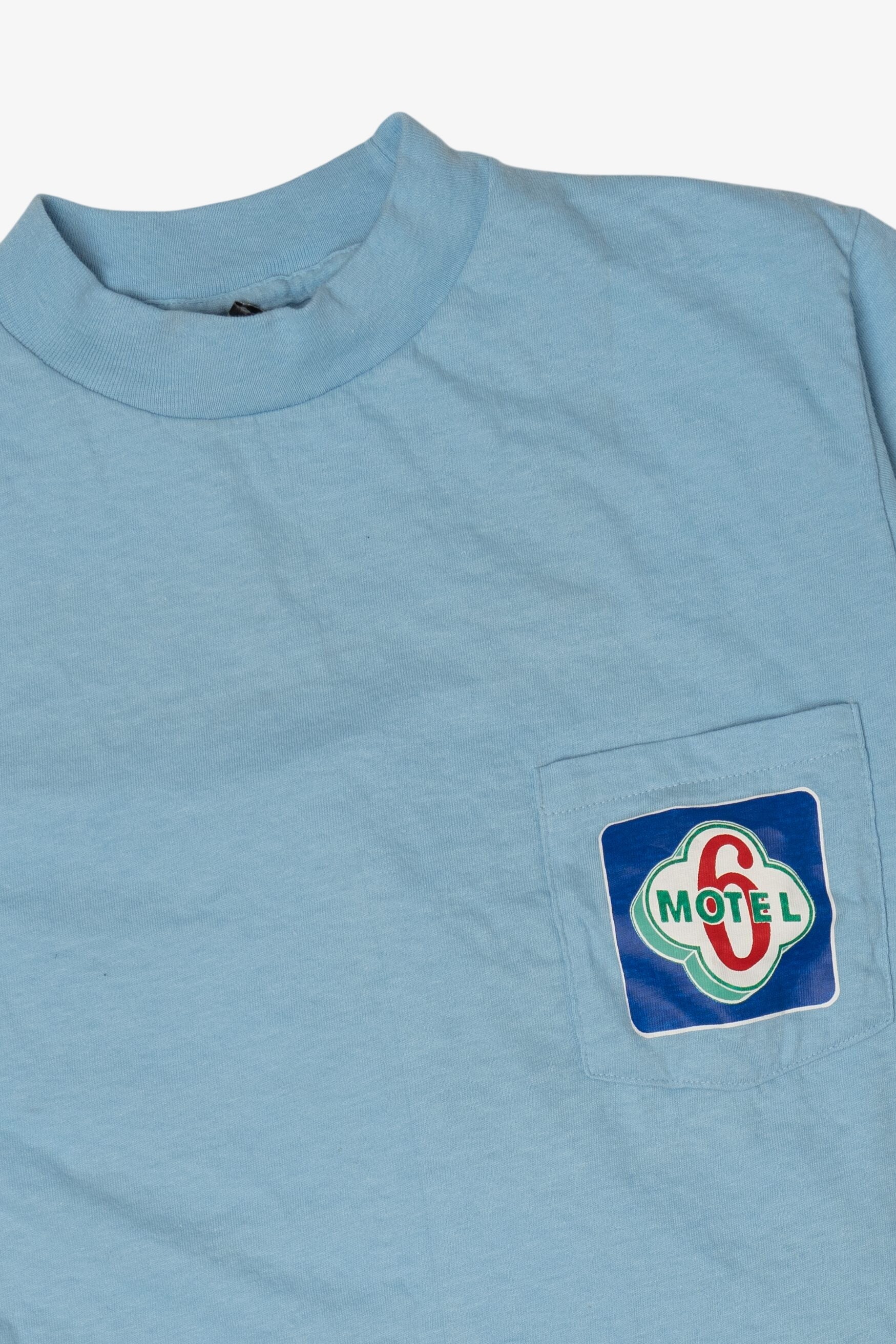 Vintage Light Blue Motel 6 Pocket T-Shirt (1980s)