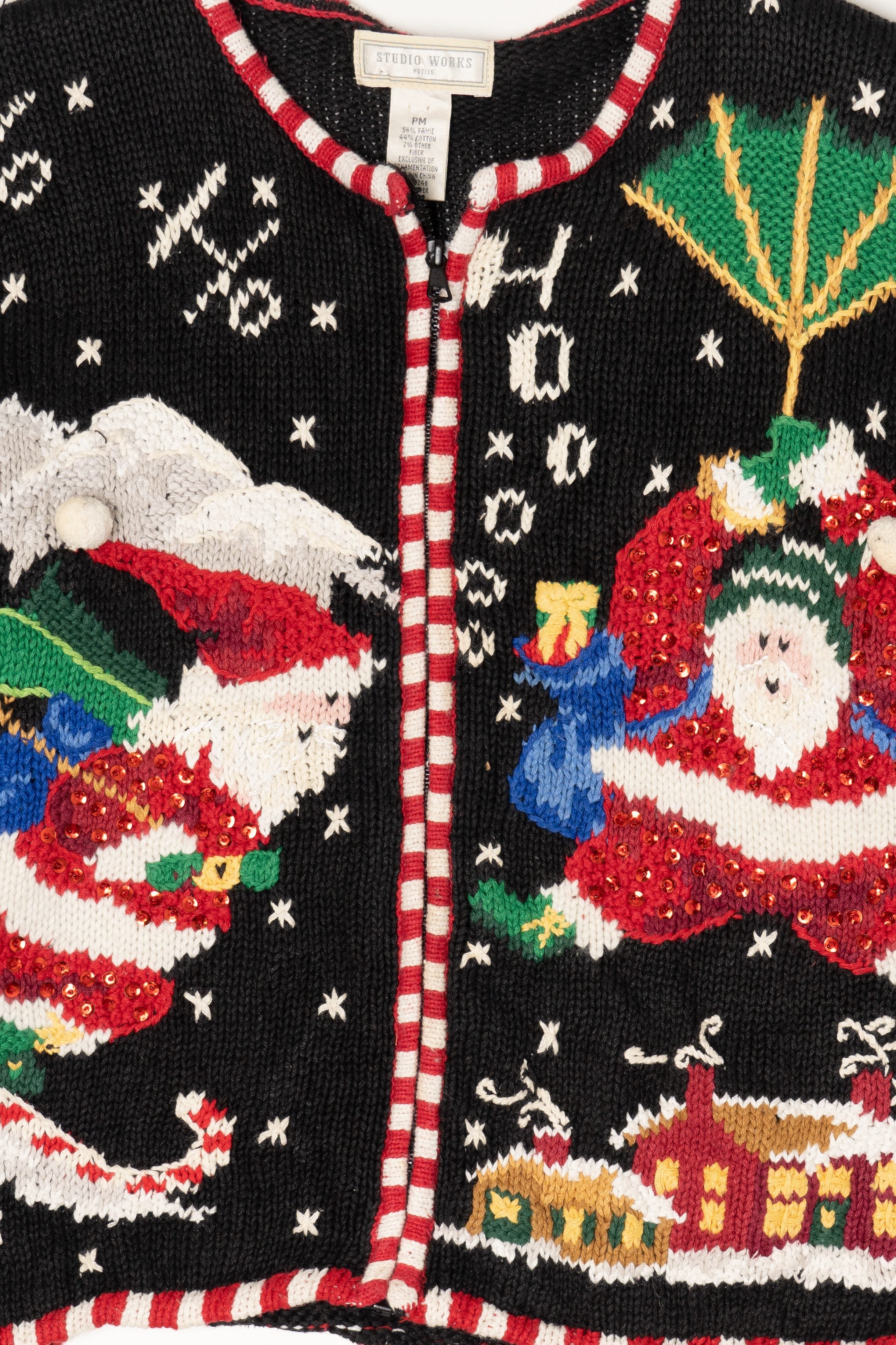 Vintage Black Studio Works Santa Skiing Parachuting Ugly Christmas Cardigan (1990s)