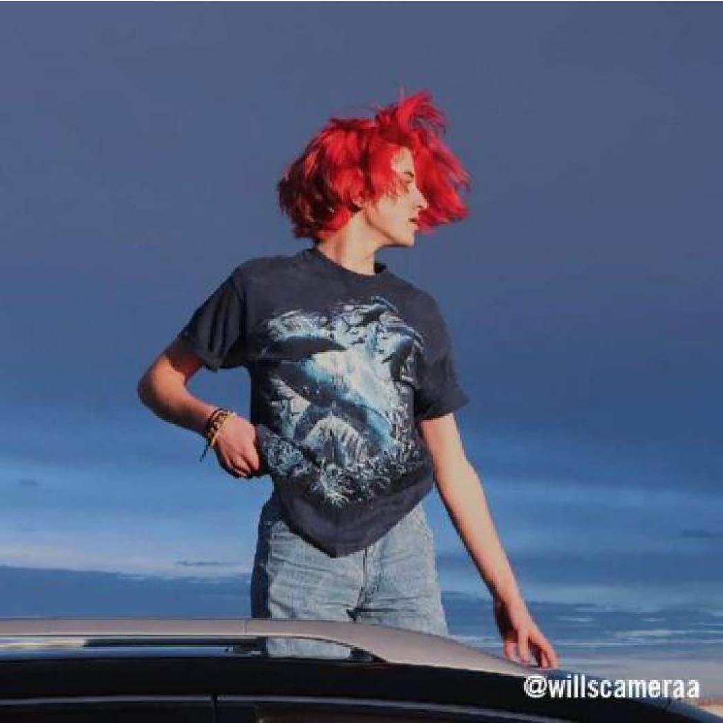 Customer @willscameraa rocking a wolf graphic t-shirt and mom jeans–true 90's vibe