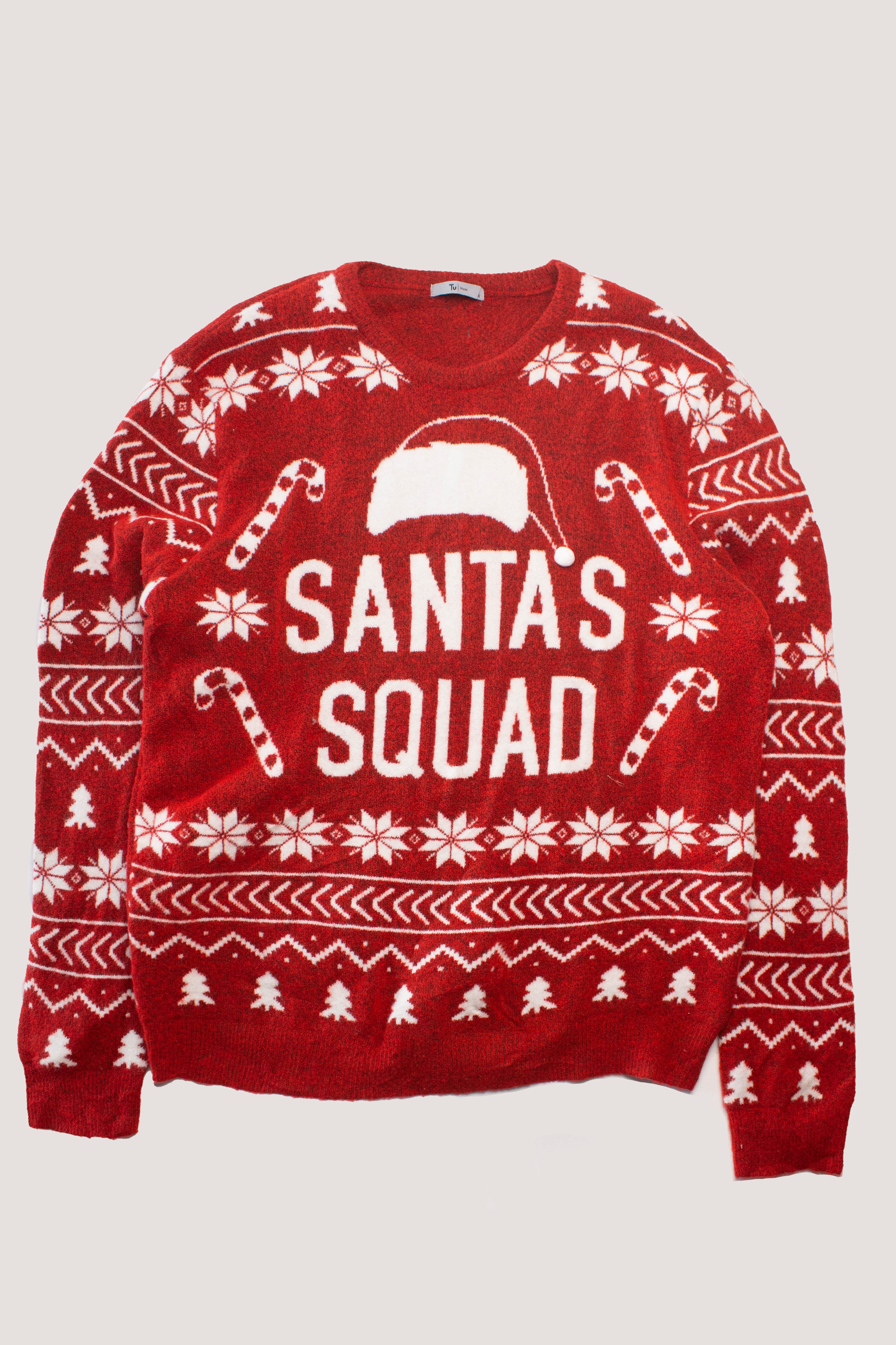 Red oversized Christmas sweater with white patterns featuring candy canes and "Santa's Squad" text with a Santa hat design