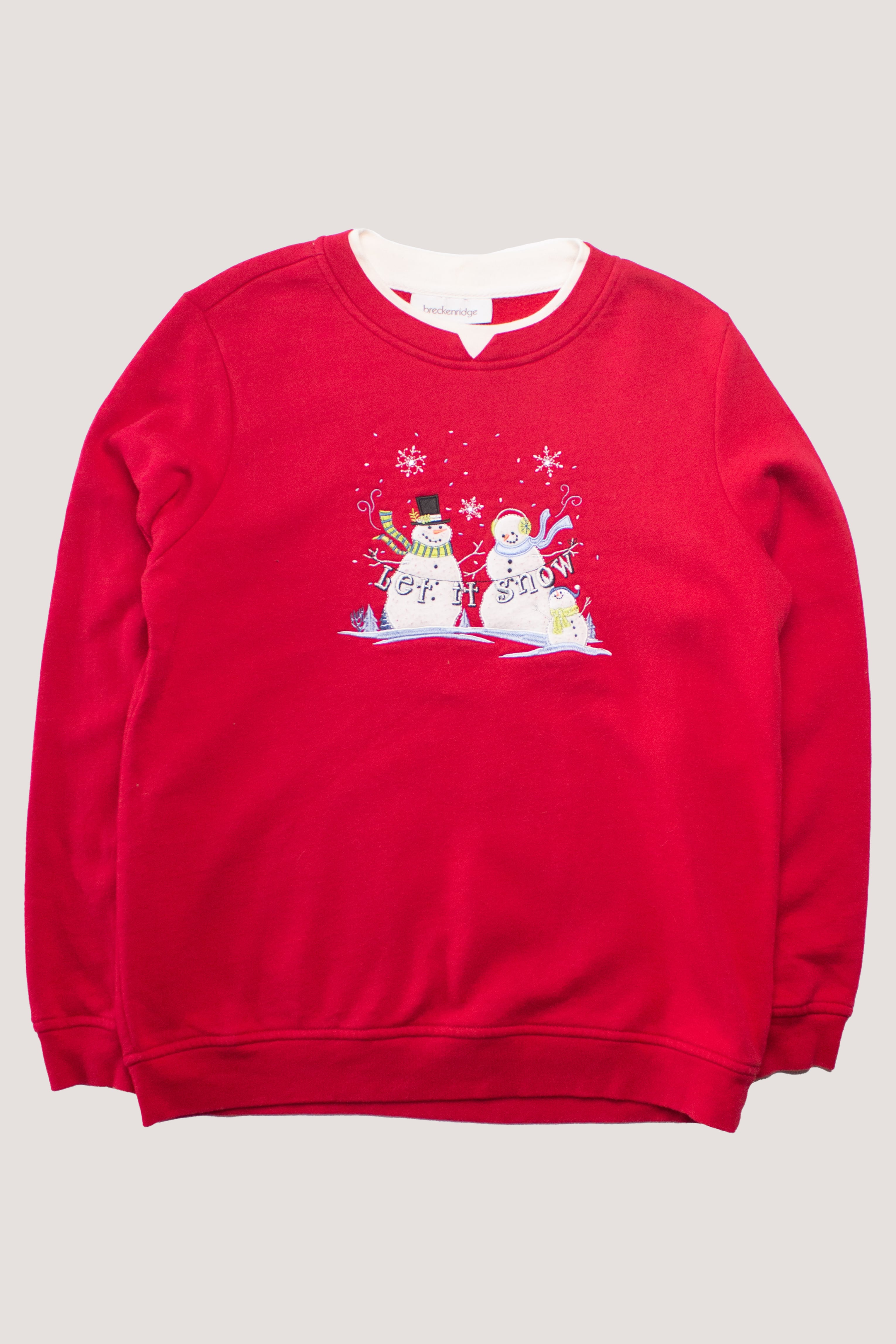 Red vintage women's Christmas sweatshirt with snowman and "Let It Snow" embroidered design on front