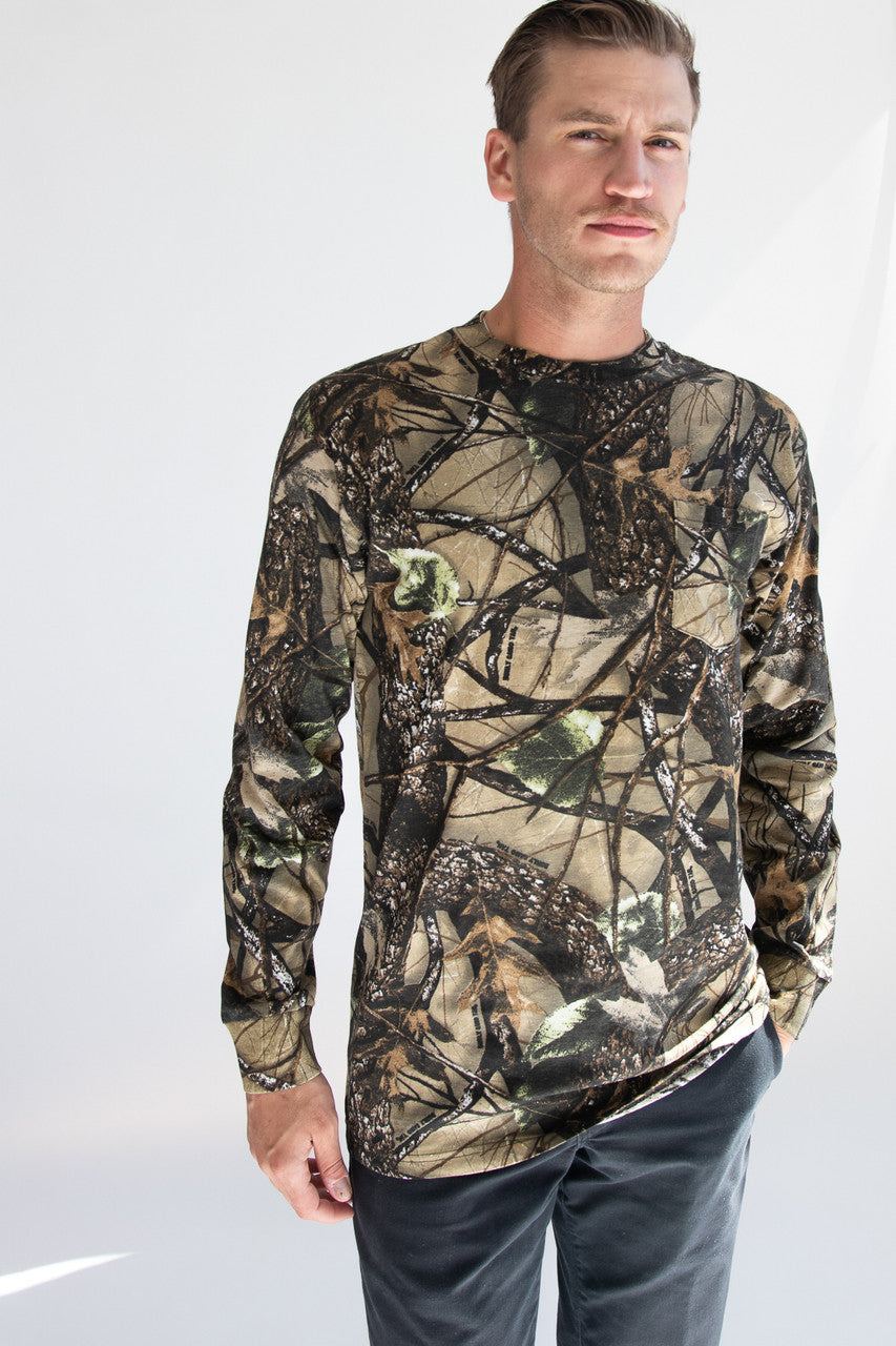 Man wearing woodland print camo long sleeve t-shirt