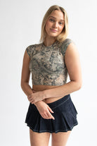 Woman wearing woodland print t-shirt