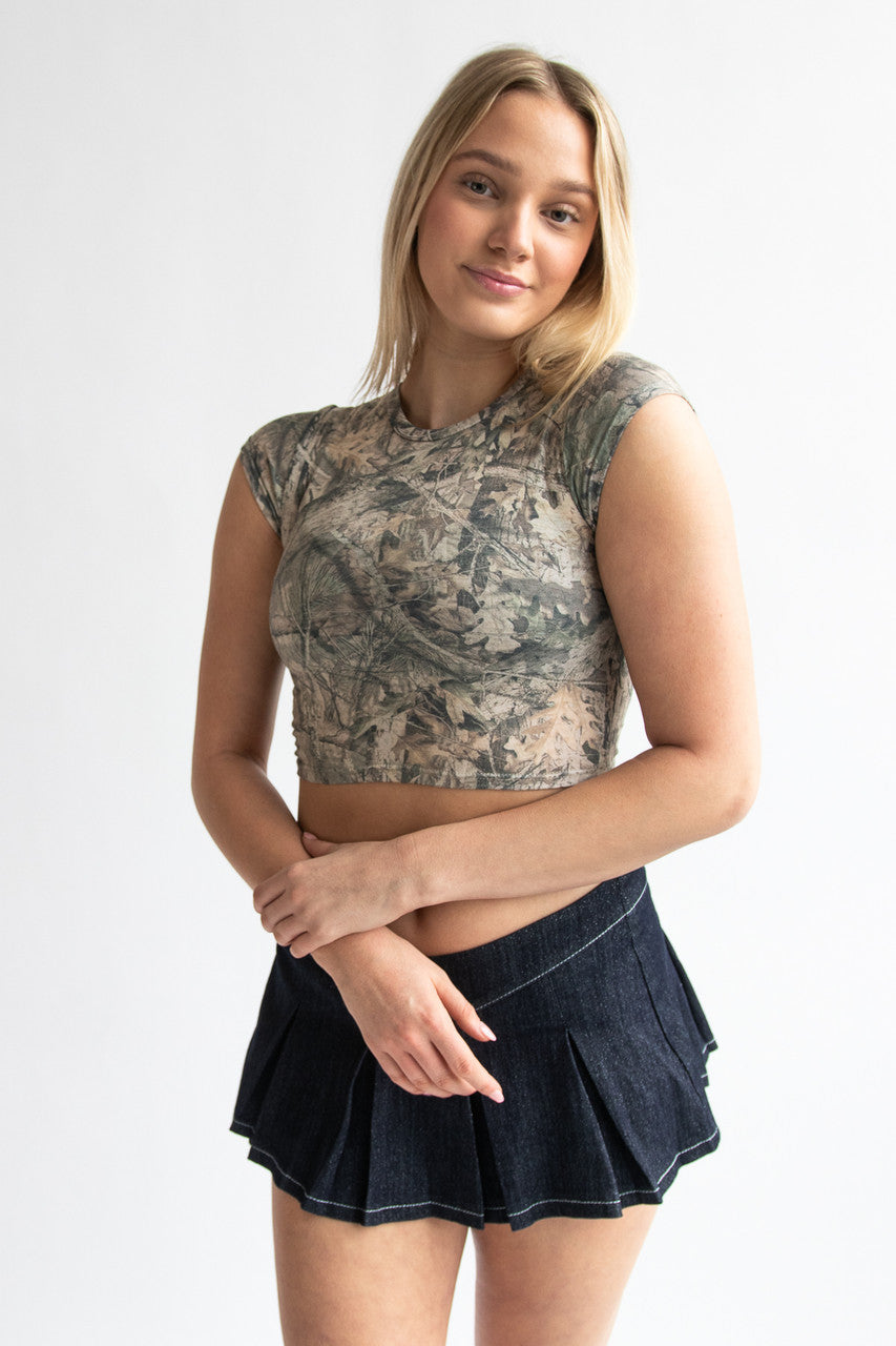 Woman wearing woodland print t-shirt