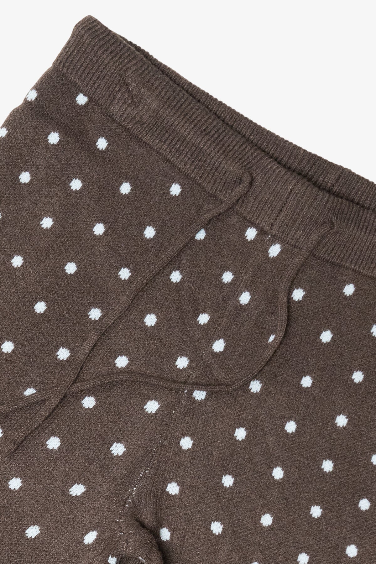 Brown knit tights with white polka dots and a ribbed elastic waistband