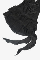 Black halter mini dress with tiered ruffle skirt and long draped ties