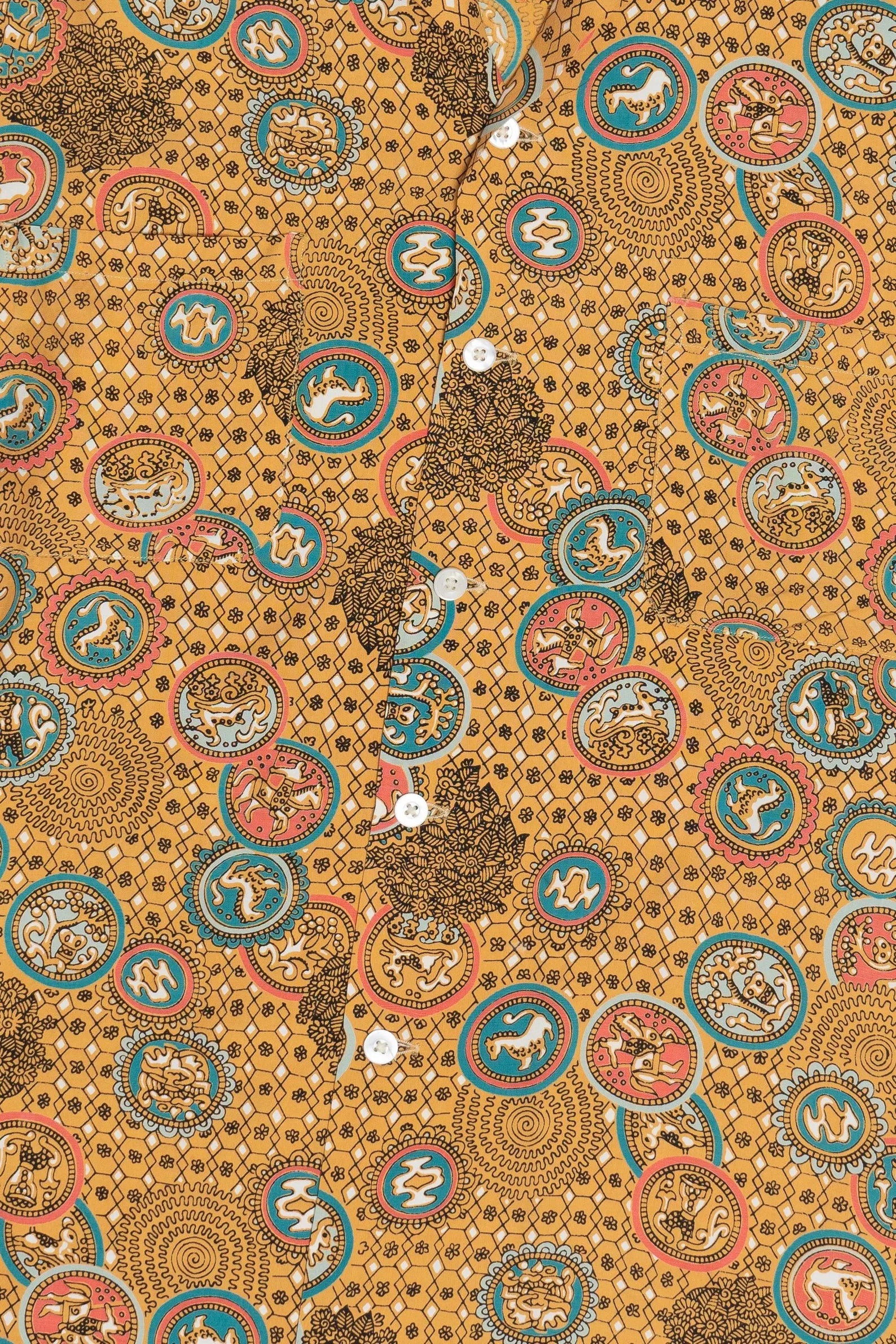 Patterned fabric with circular designs on a brown background