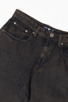 Washed dark brown denim jeans showing waistband, front pockets, and Company label