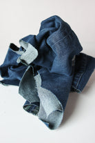 Piled assortment of mixed near denim fabric wiping cloths