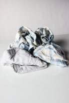 Piled assortment of mixed flannel fabric wiping cloths