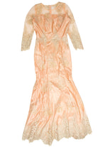 Vintage pink 1980s formal dress with lace sleeves and floral embroidery on satin fabric