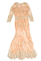 Vintage 1980s pink formal dress with lace sleeves and intricate floral embroidery detailing on sheer fabric