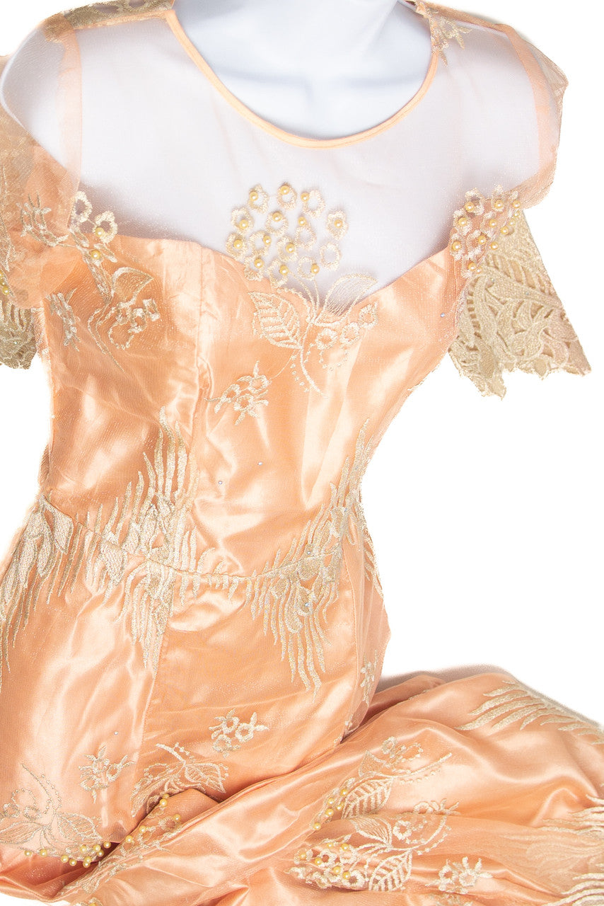 Close-up of vintage 1980s pink satin formal dress with floral embroidery and lace details on sheer neckline and sleeves