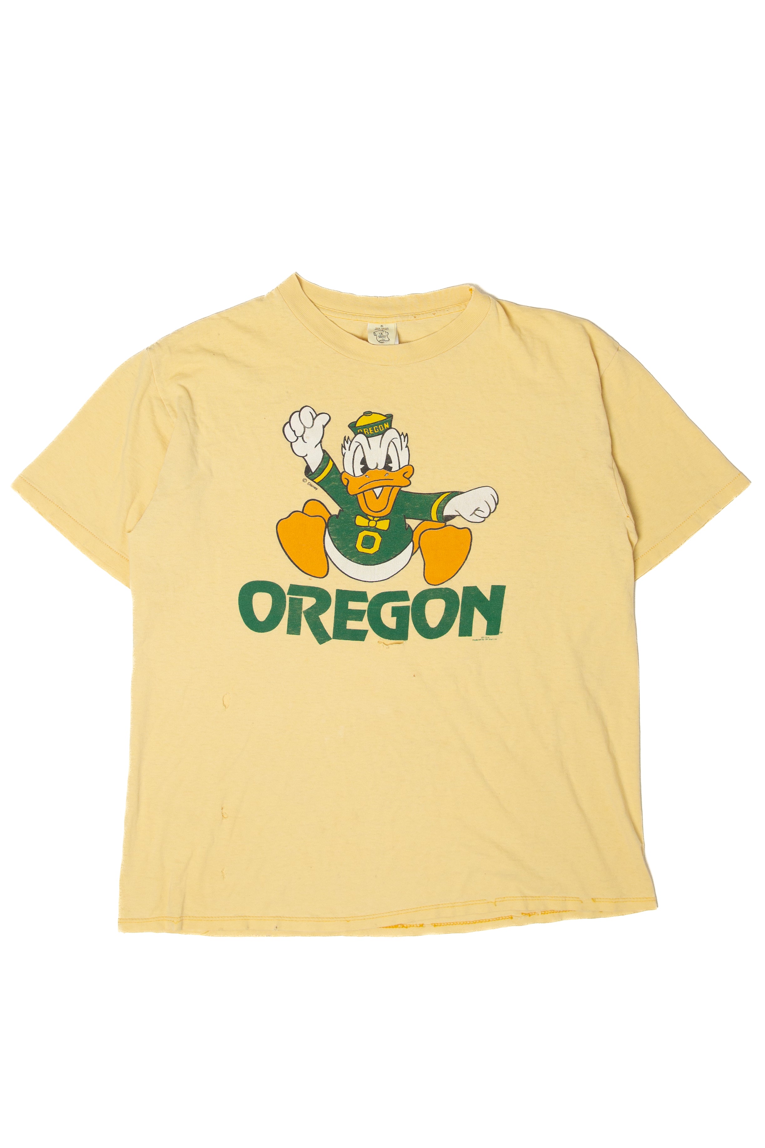 Vintage yellow Donald Duck t-shirt with Oregon logo and distressed single stitch from the 1990s vintage collection