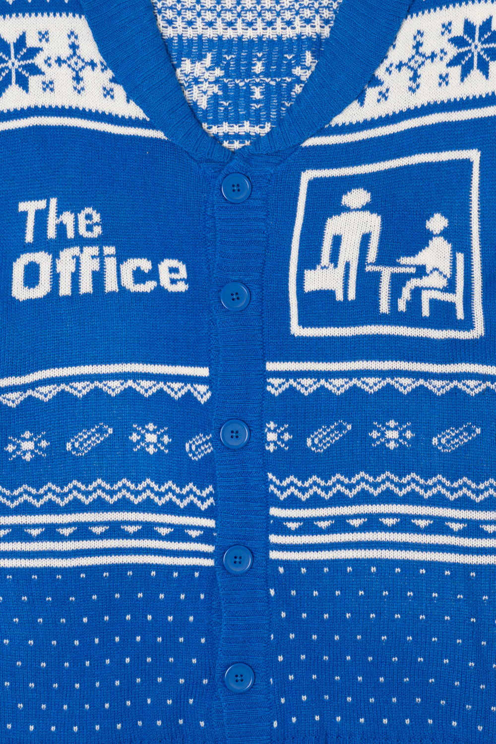 Blue cardigan with white patterns and 'The Office' text and graphics.