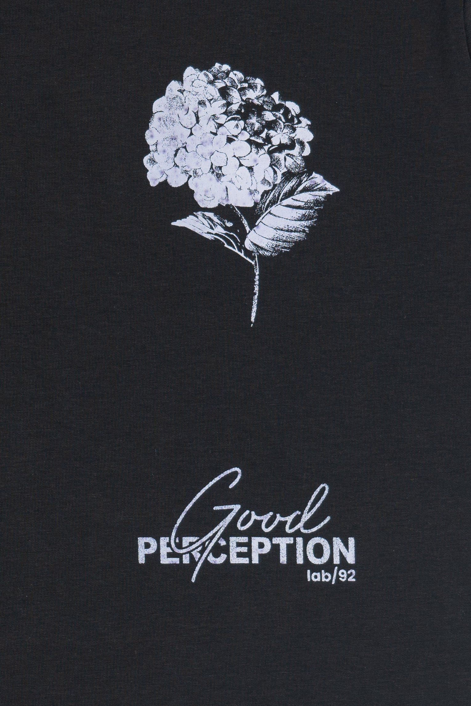 Black t-shirt with white floral design and 'Good Perception' text on a black background