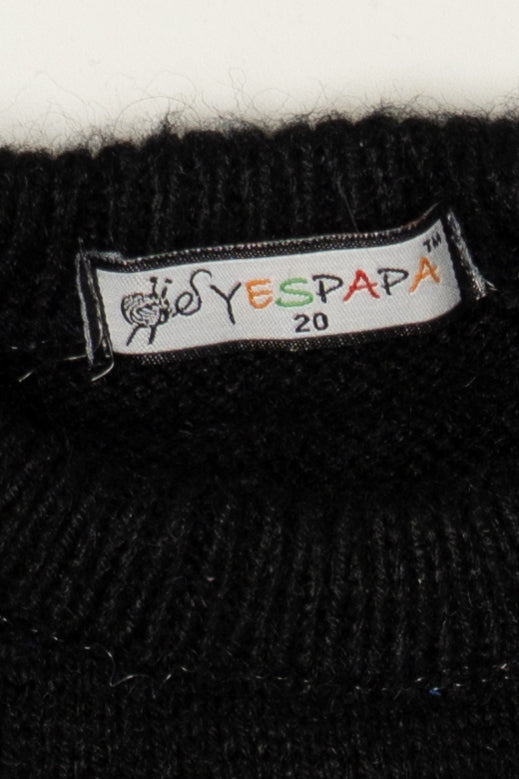 White brand label reading YESPAPA 20 sewn into the collar of a black knit sweater