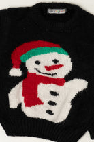 Black knit sweater featuring a smiling snowman in a red Santa hat and scarf by YESPAPA