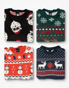 Set of four folded ugly Christmas sweaters featuring Santa, snowmen, reindeer, and CHRISTMAS lettering