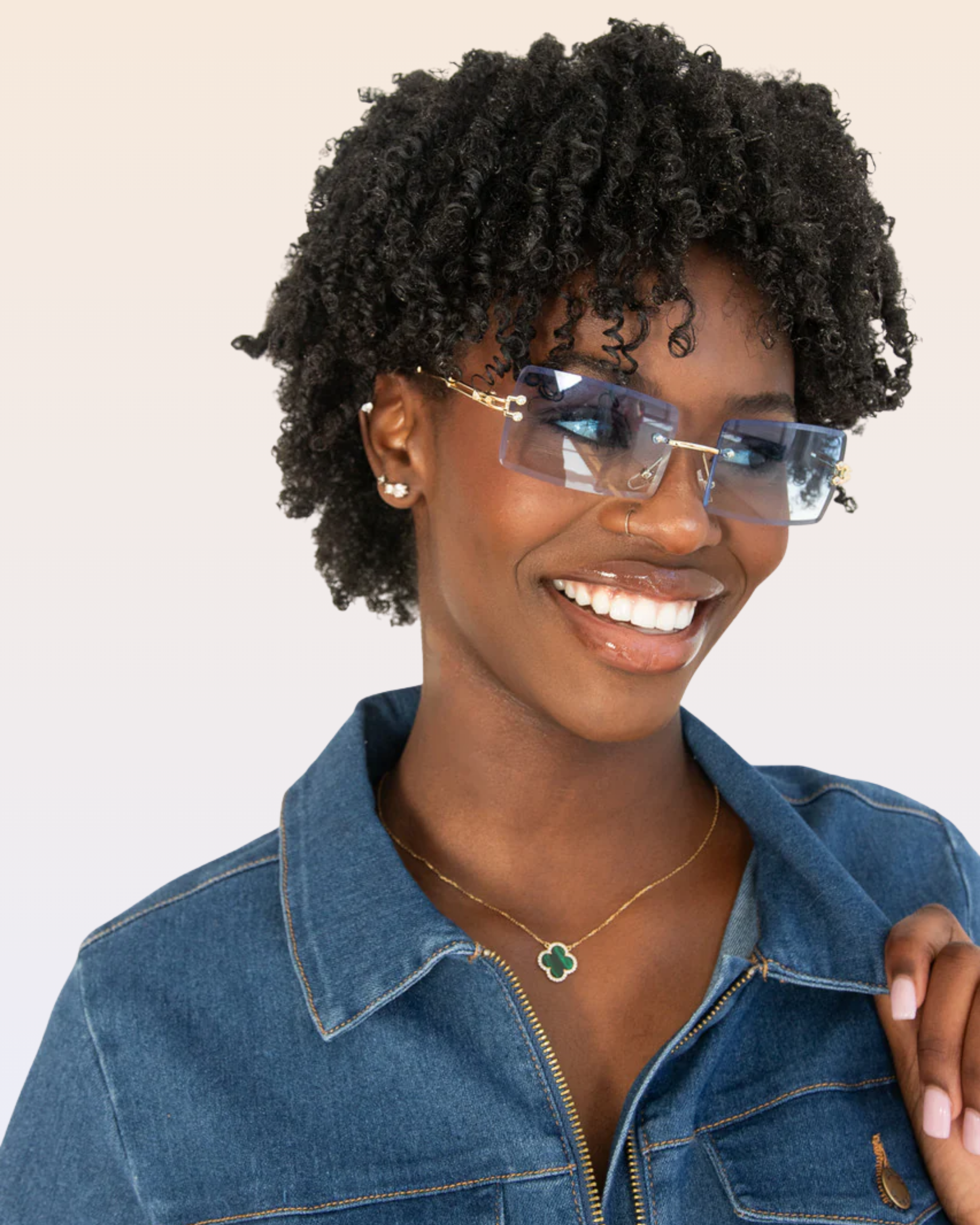 Blue sunglasses and gold/green necklace