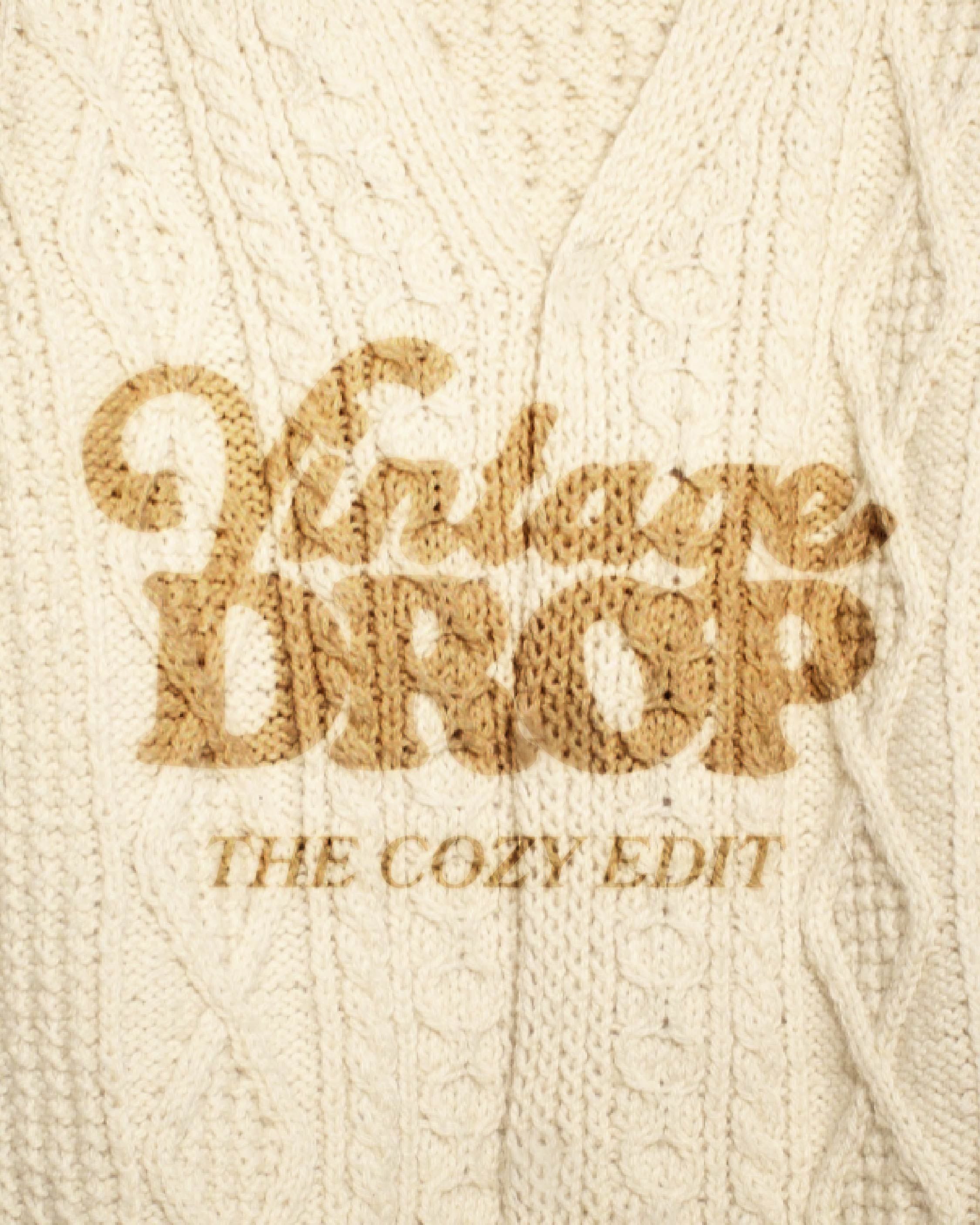 cozy sweater featuring the text "vintage drop the cozy edit"
