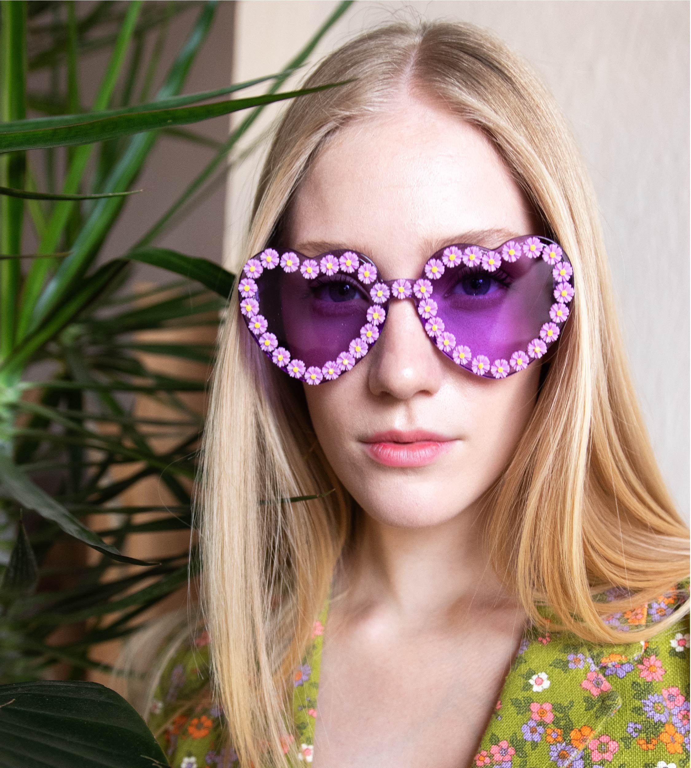 female model wearing purple heart sunglasses