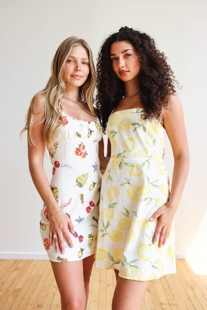 two models in summer linen dresses