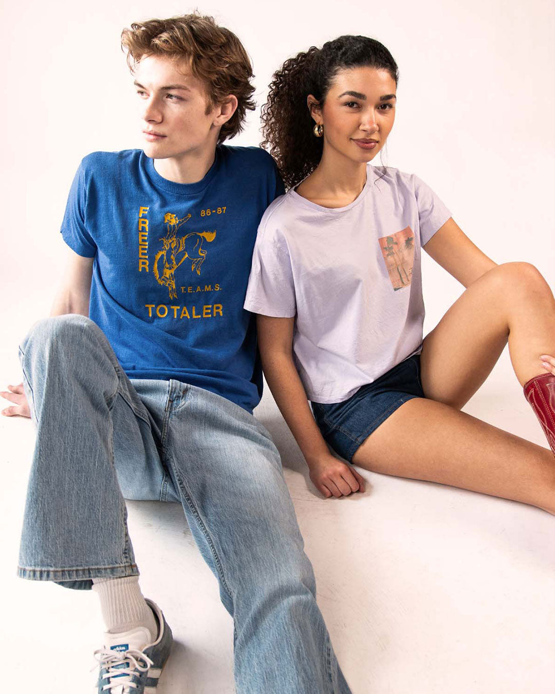 Two models wearing vintage graphic tees