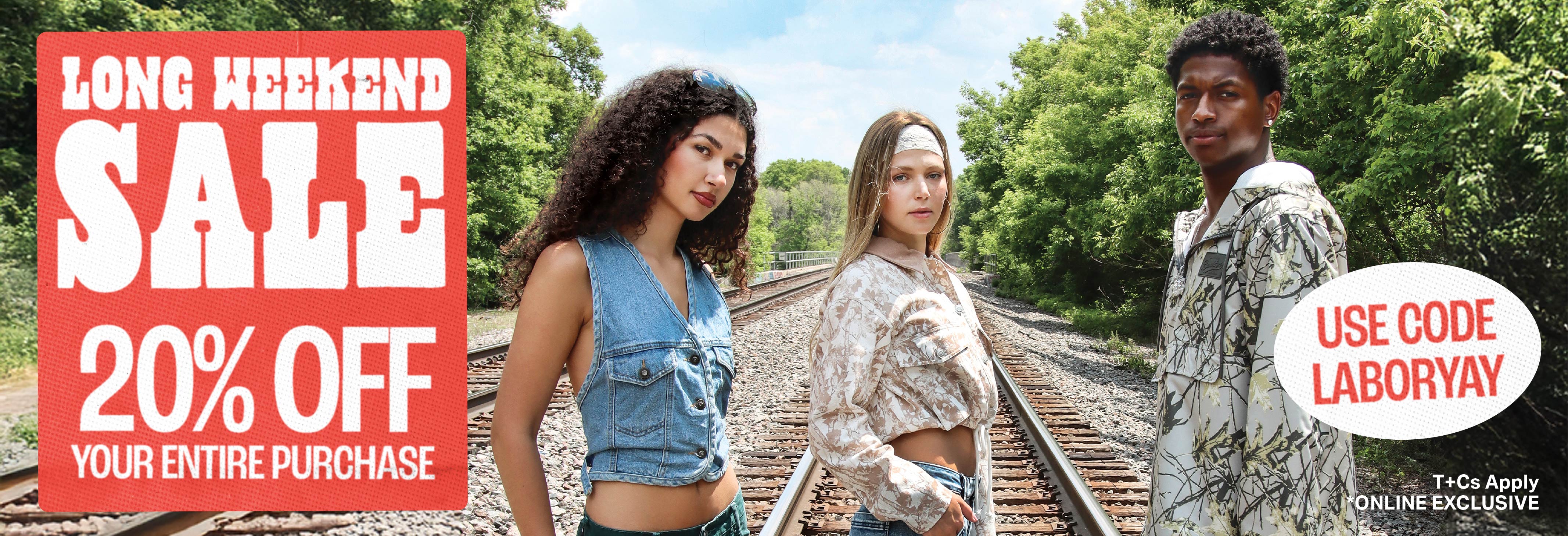 three models on a train track outside wearing new and vintage fashion. advertising the long weekend sale. 20% off your entire purchase with code LABORYAY. T+Cs apply online exclusive