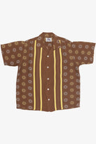 Brown shirt with yellow stripes and floral patterns on a white background