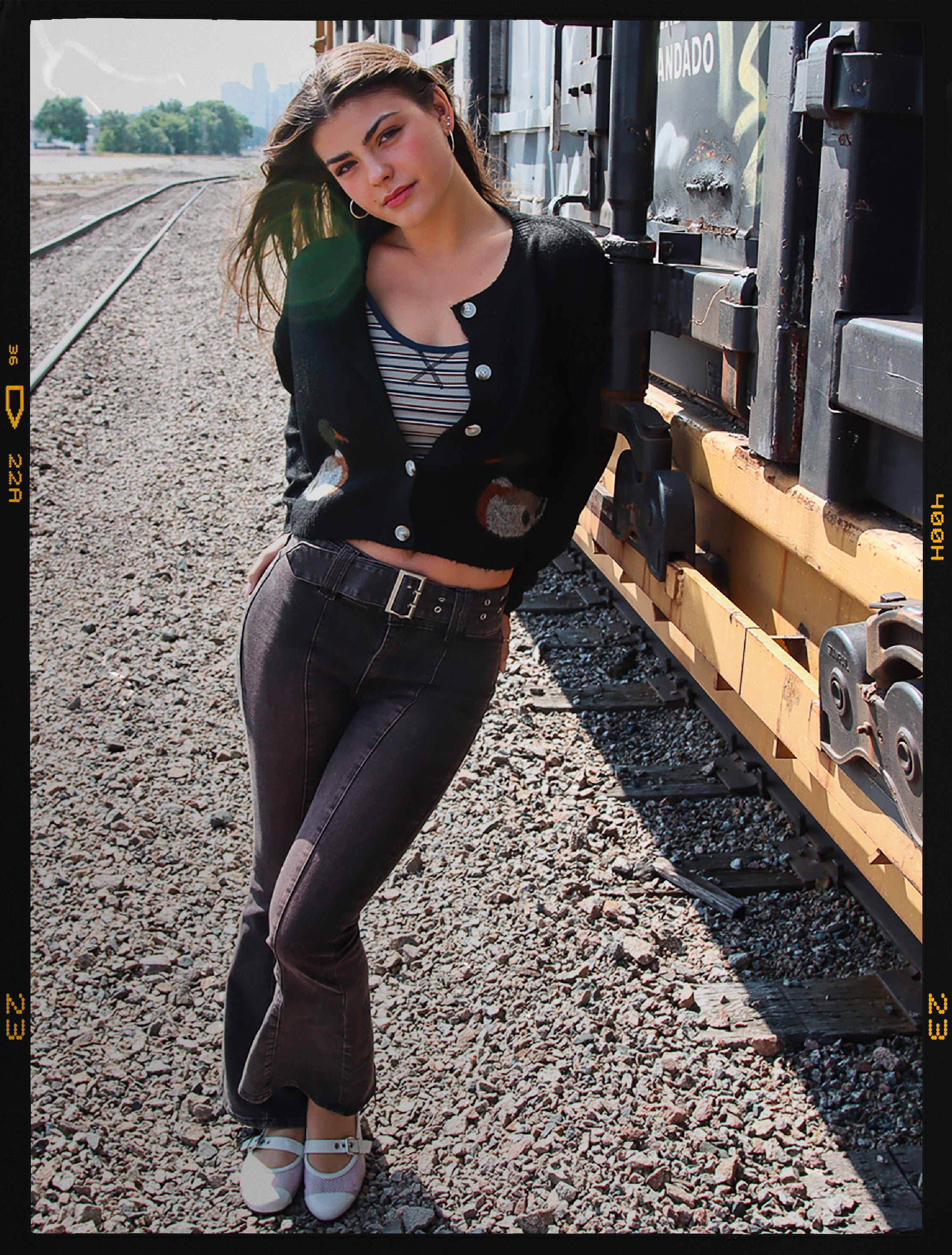 model wearing mallard cardigan and belted flare denim